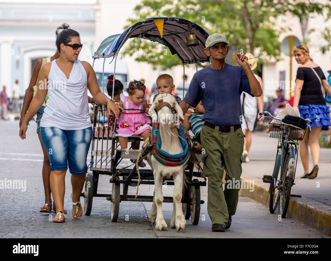 Children pleasure, drawn by a goat kids Carriage, Street Life in the center of Santa Clara at Parque de Santa Clara, Santa Clara Stock Photo