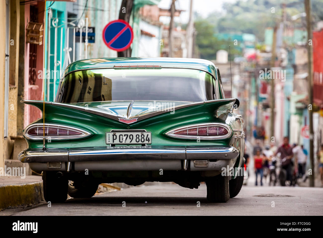 Vintage, historical street cruiser, green Impala, Streetlife in the center of Santa Clara at Parque de Santa Clara, Cuba, Stock Photo