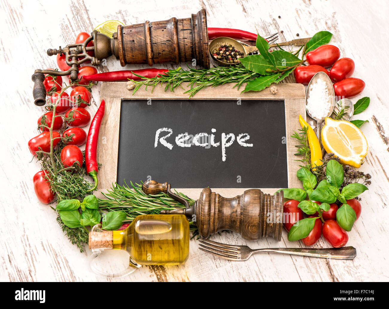 Fresh vegetables, spices and herbs with blackboard. Food ingredients. Sample text Recipe Stock Photo