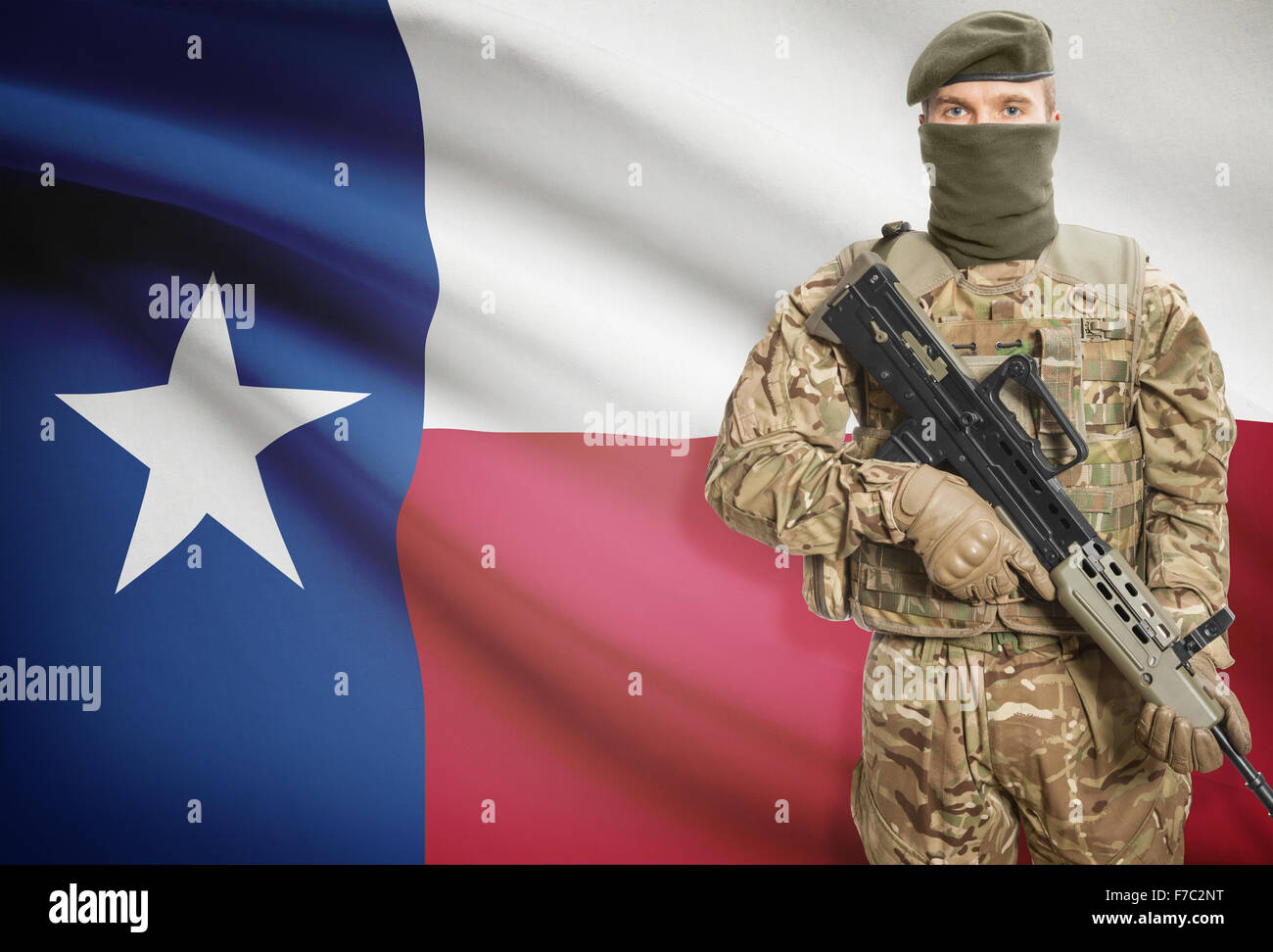 Soldier holding machine gun with USA state flag on background - Texas ...