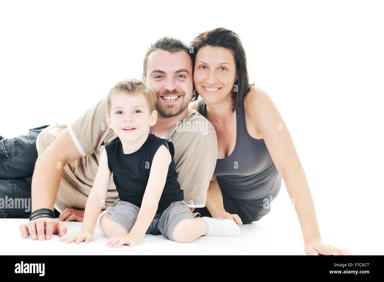 happy young family man and woman play with beautiful child son isolated ...
