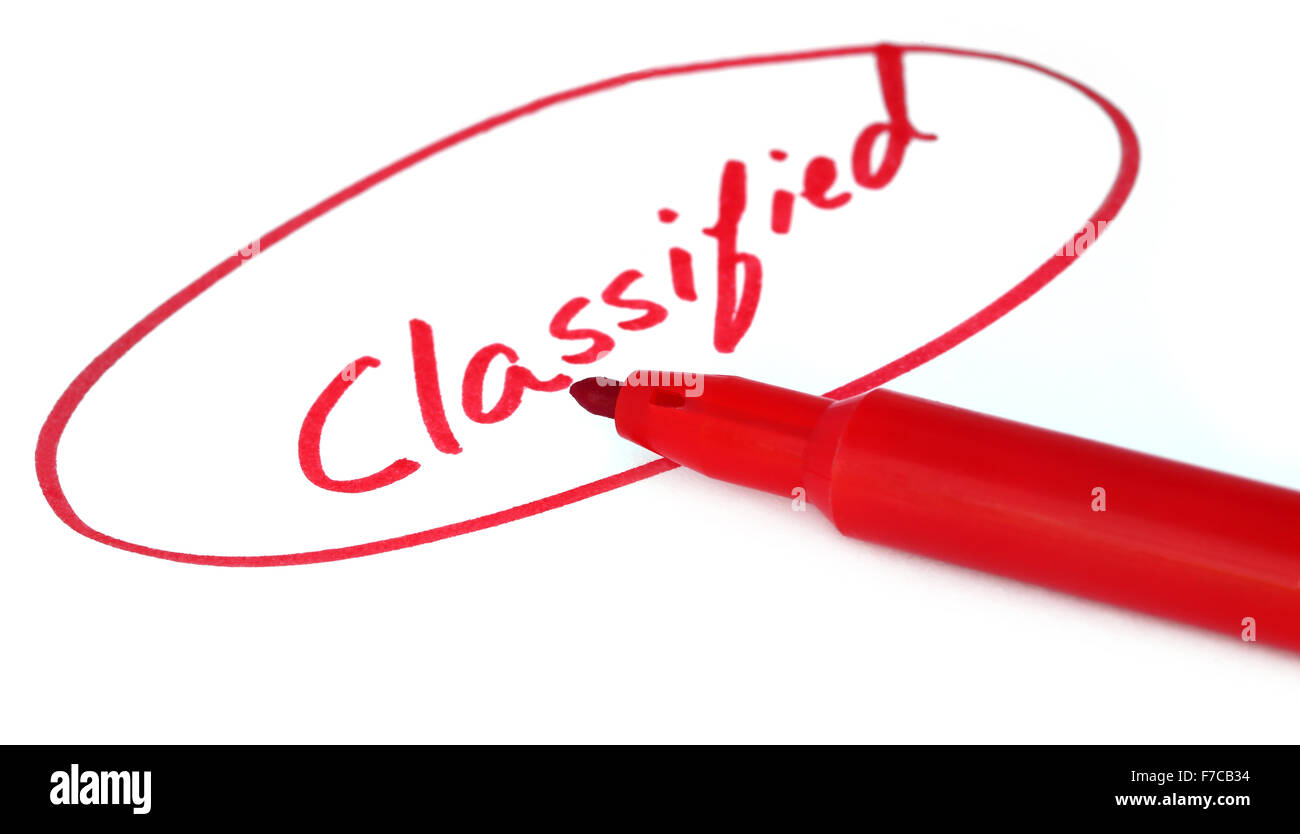 Classified written in red letters with sign pen Stock Photo
