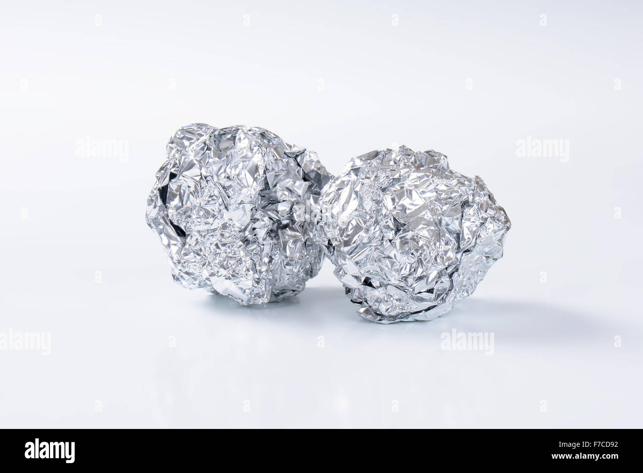 Tin foil crumpled up into a ball shape Stock Photo Alamy