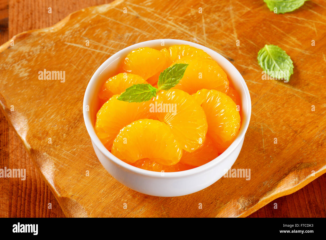 Bowl of peeled mandarin orange segments in light syrup Stock Photo