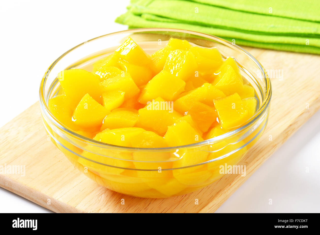 Bowl of diced peach in light syrup Stock Photo Alamy