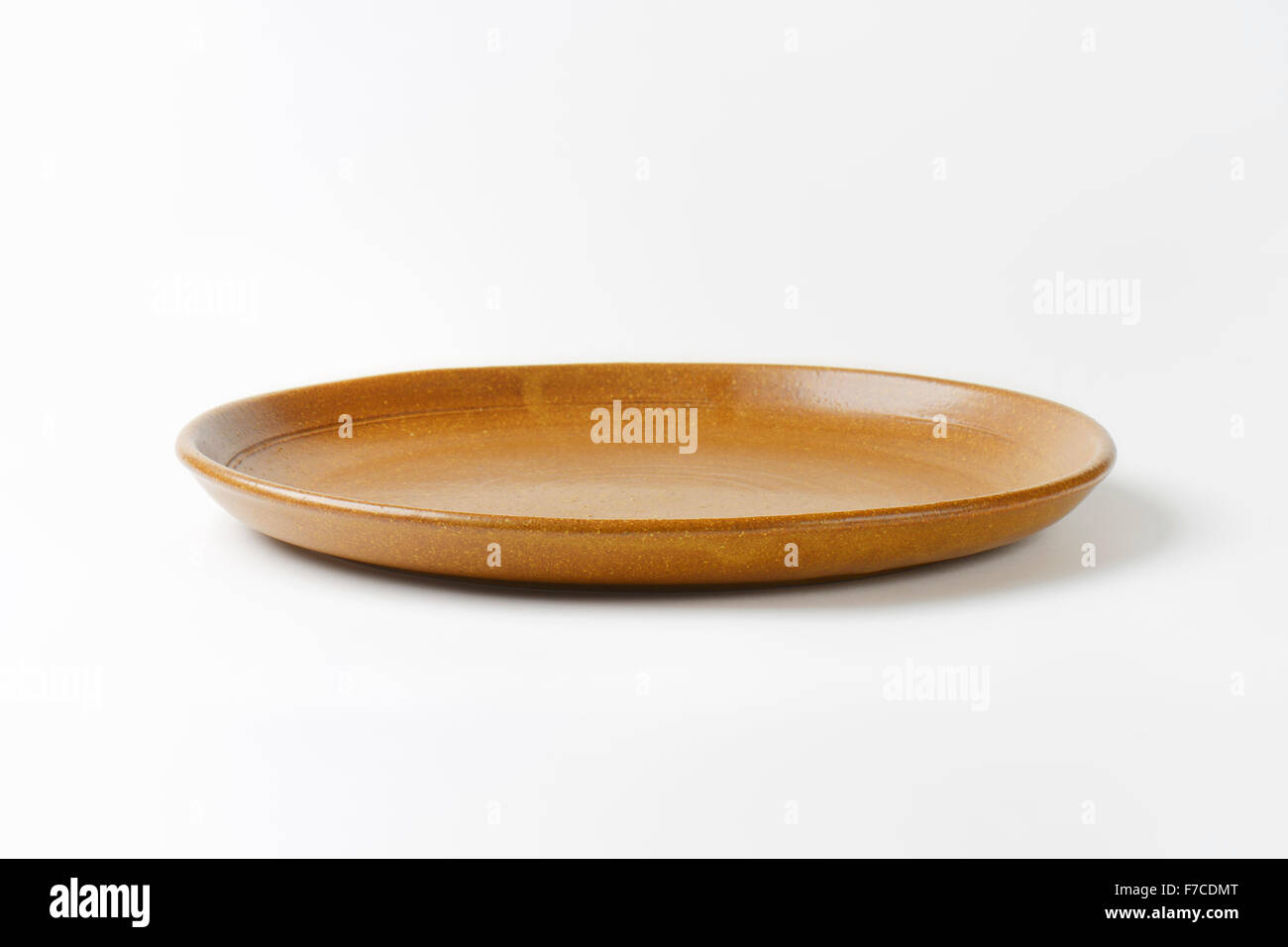 Round brown ceramic dinner plate Stock Photo Alamy