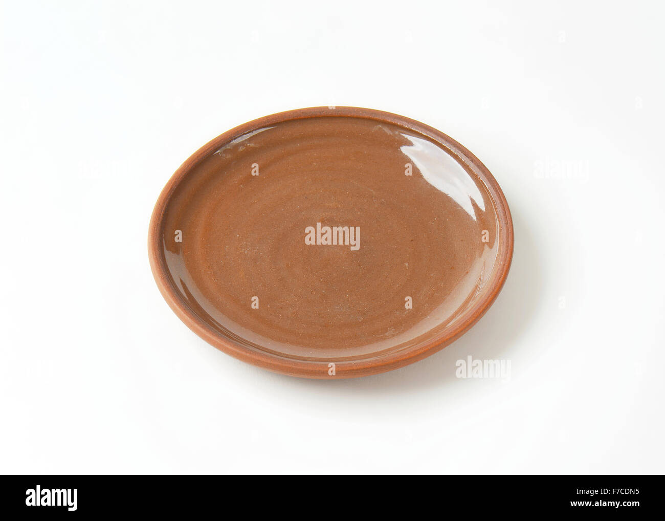 Round brown ceramic dinner plate Stock Photo