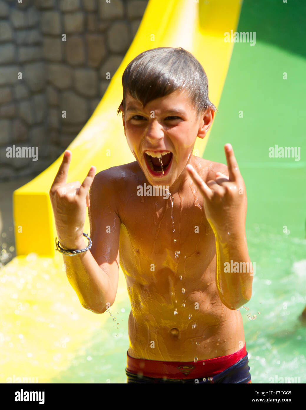 screaming child on water slide at amusement park Stock Photo