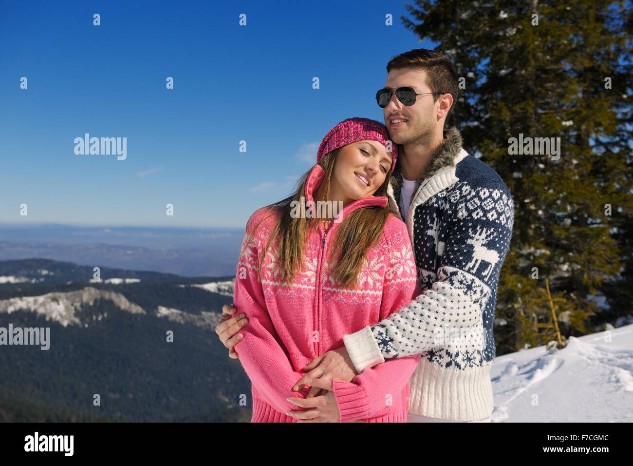 Young Couple In winter Snow Scene at beautiful sunny day Stock Photo ...