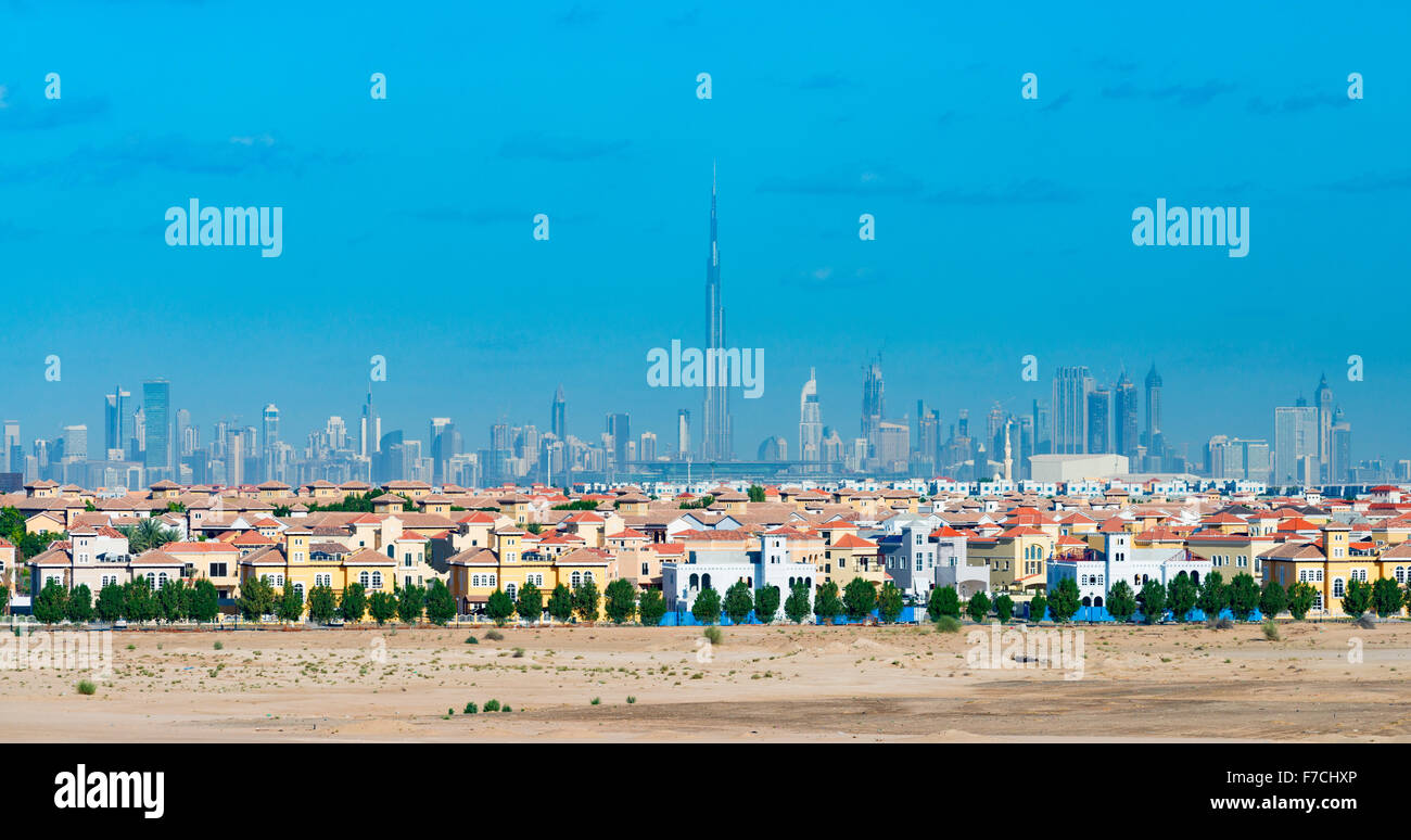 Skyline of Dubai with modern luxury villas at The Villa residential housing development in foreground in United Arab Emirates Stock Photo