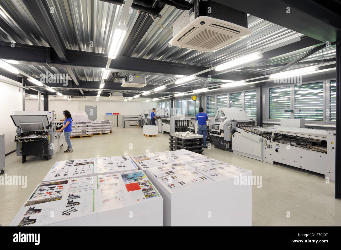 Lugano, Switzerland - 29 May 2013: people working at offset printing machines at Lugano on Switzerland Stock Photo
