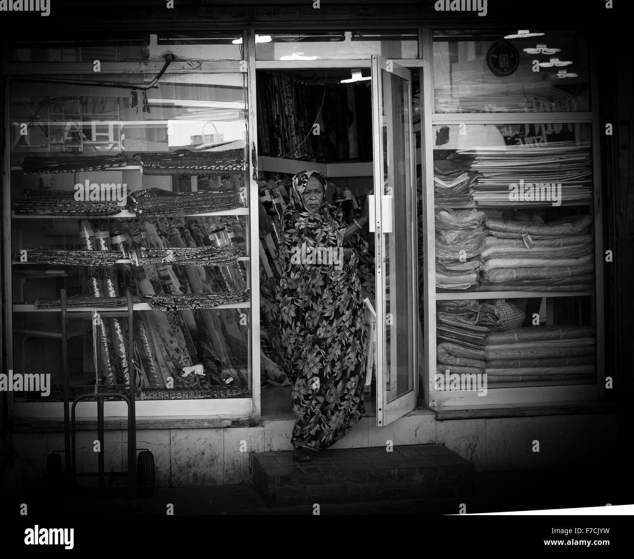 Woman leaving a shop Deira Stock Photo