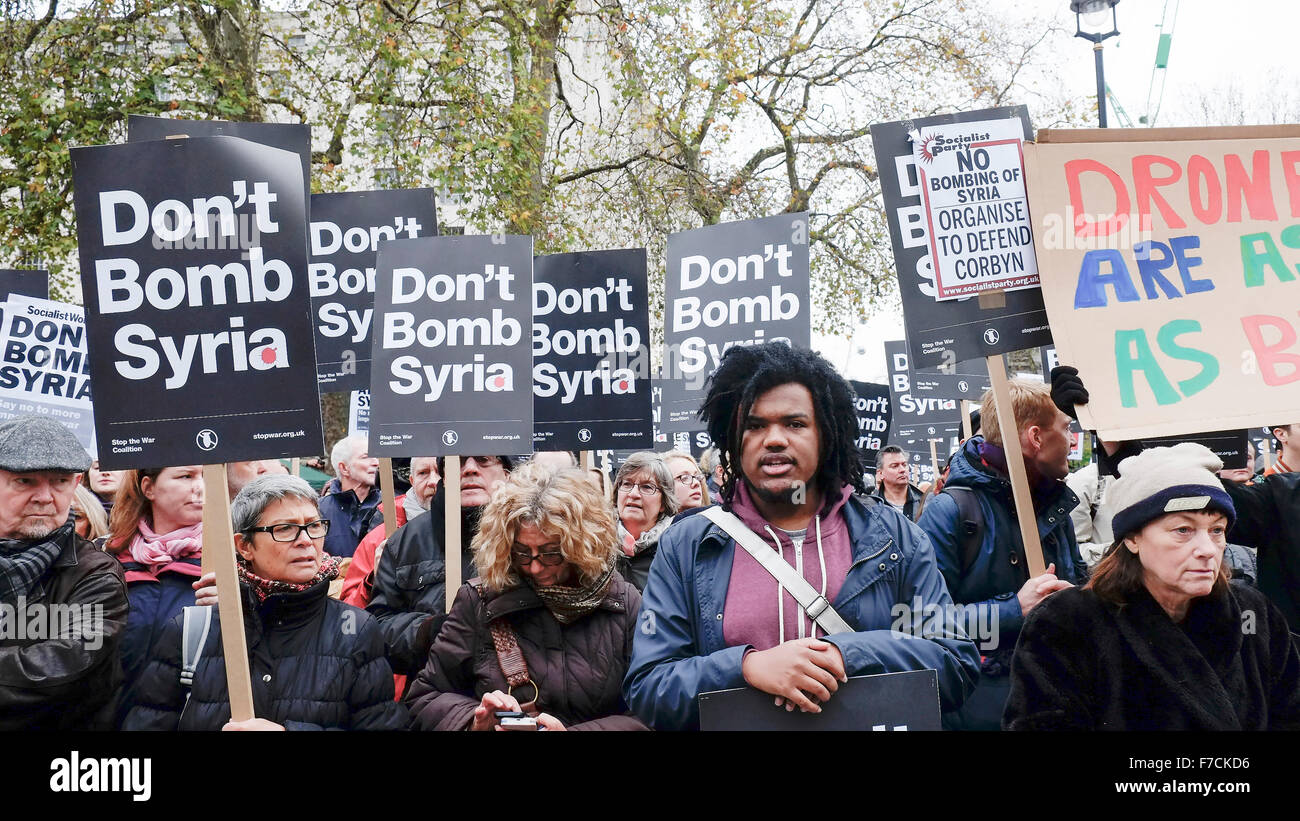 Protesters gather opposite Downing Street in London to protest at the UK government proposal to commence bombing Syria. Stock Photo