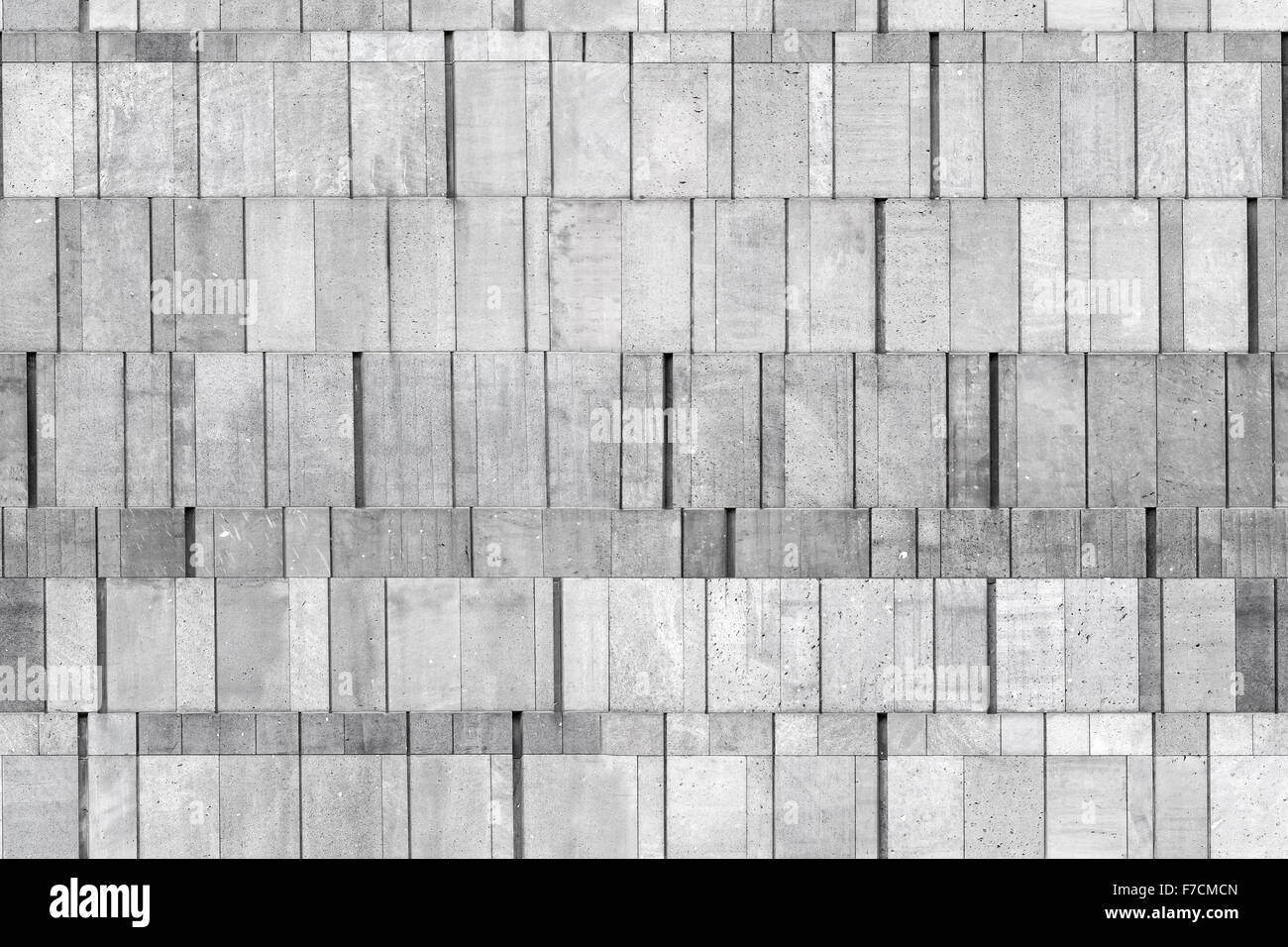 Gray concrete wall made of different size blocks, seamless background ...