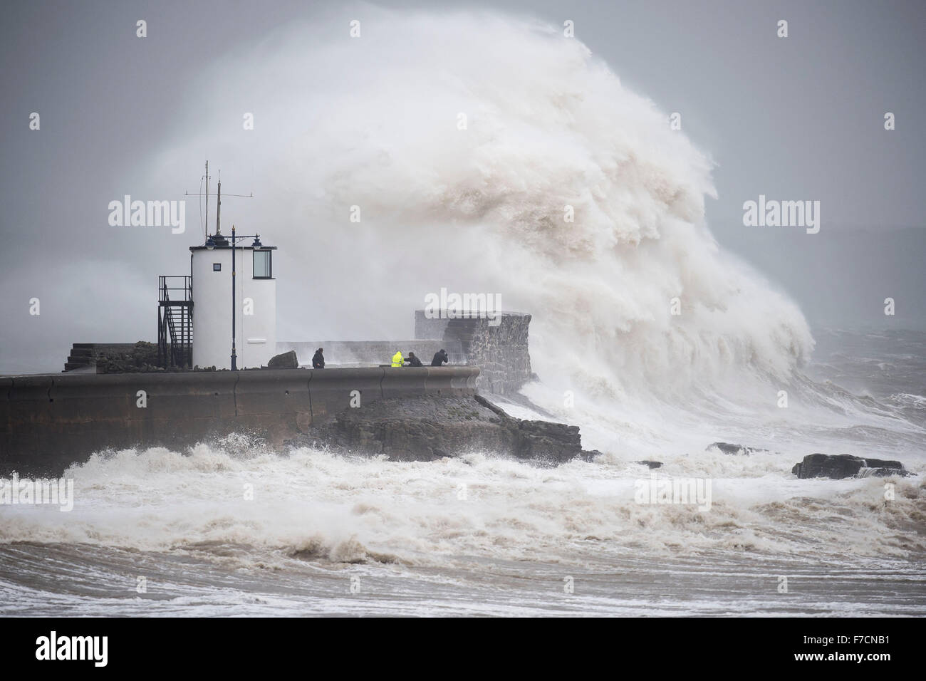 Large waves crash against the harbour wall in Porthcawl, South Wales, as storm Clodagh sweeps across South Wales. Stock Photo