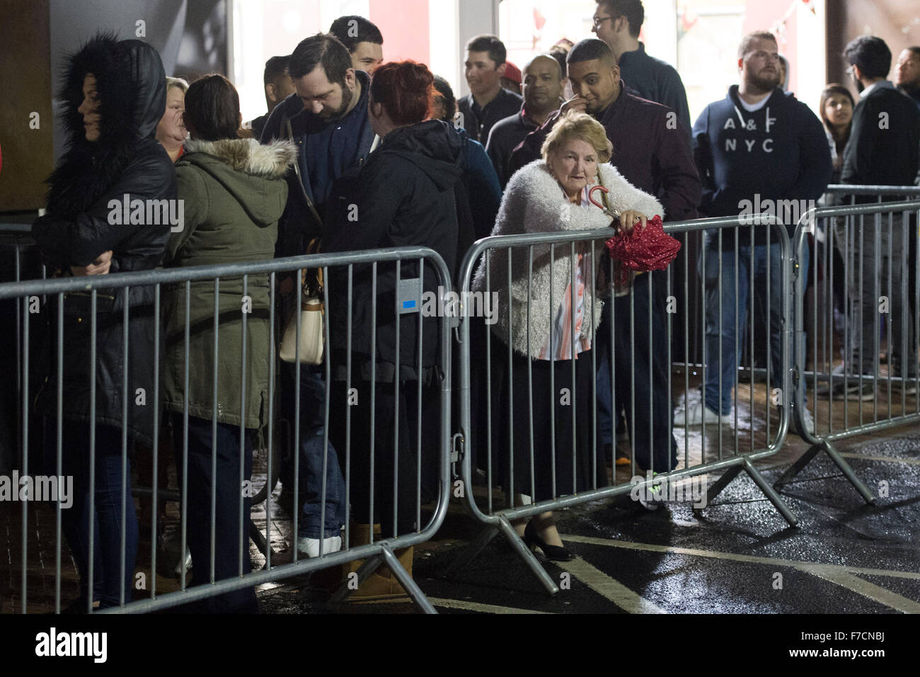 Shoppers queue for Black Friday sales at Tesco Extra supermarket on Western Avenue in Cardiff, South Wales. Stock Photo