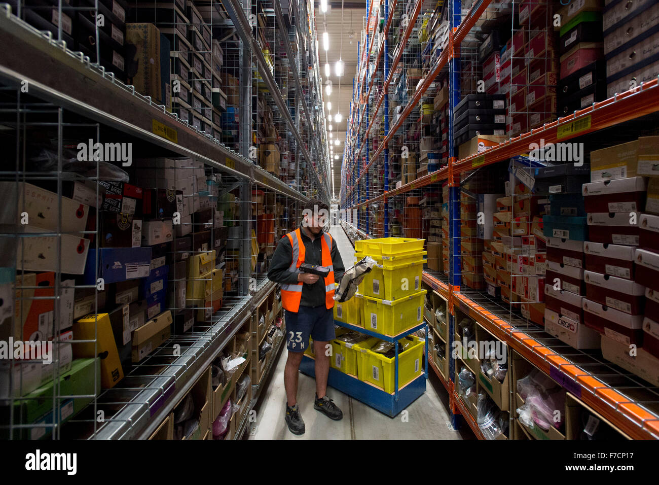 Stock pickers in the Amazon Fulfillment Centre warehouse in Swansea, Wales.  Extra staff are hired on Cyber Monday & Black Friday Stock Photo - Alamy