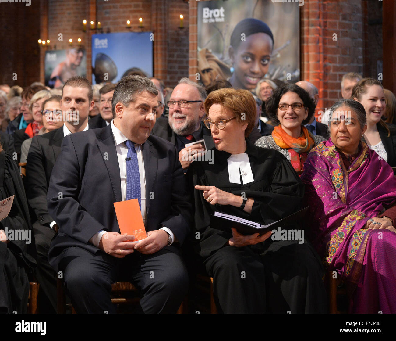 German economy minister Sigmar Gabriel (L), Cornelia Fuellkrug-Weitzel (C), president of the 'Brot fuer die Welt' (lit. Bread for the world) aid organisation, and Vandana Shiva, Indian environmental activist and winner of the Right Livelihood Award, also known as the Alternative Nobel Prize, attend the launch event of the 57th donation campaign by the evangelical aid organisation 'Bread for the world' in Hanover, Germany, 29 November 2015. Photo: JENS SCHULZE/dpa Stock Photo