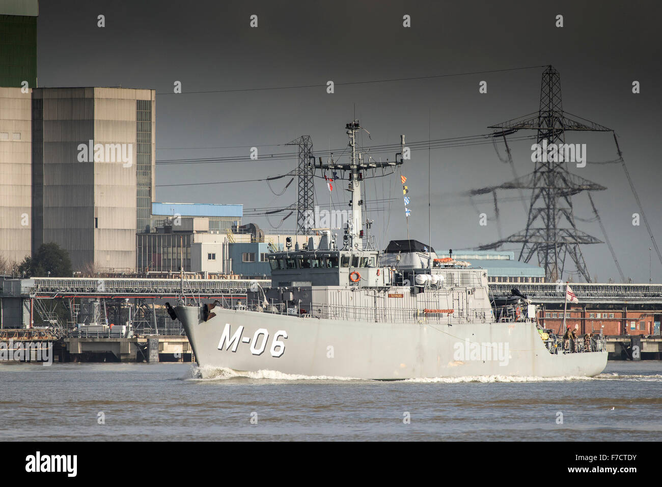 The NATO minehunter LVNS Talivaldis (M-06) steams upriver on the River Thames. Stock Photo