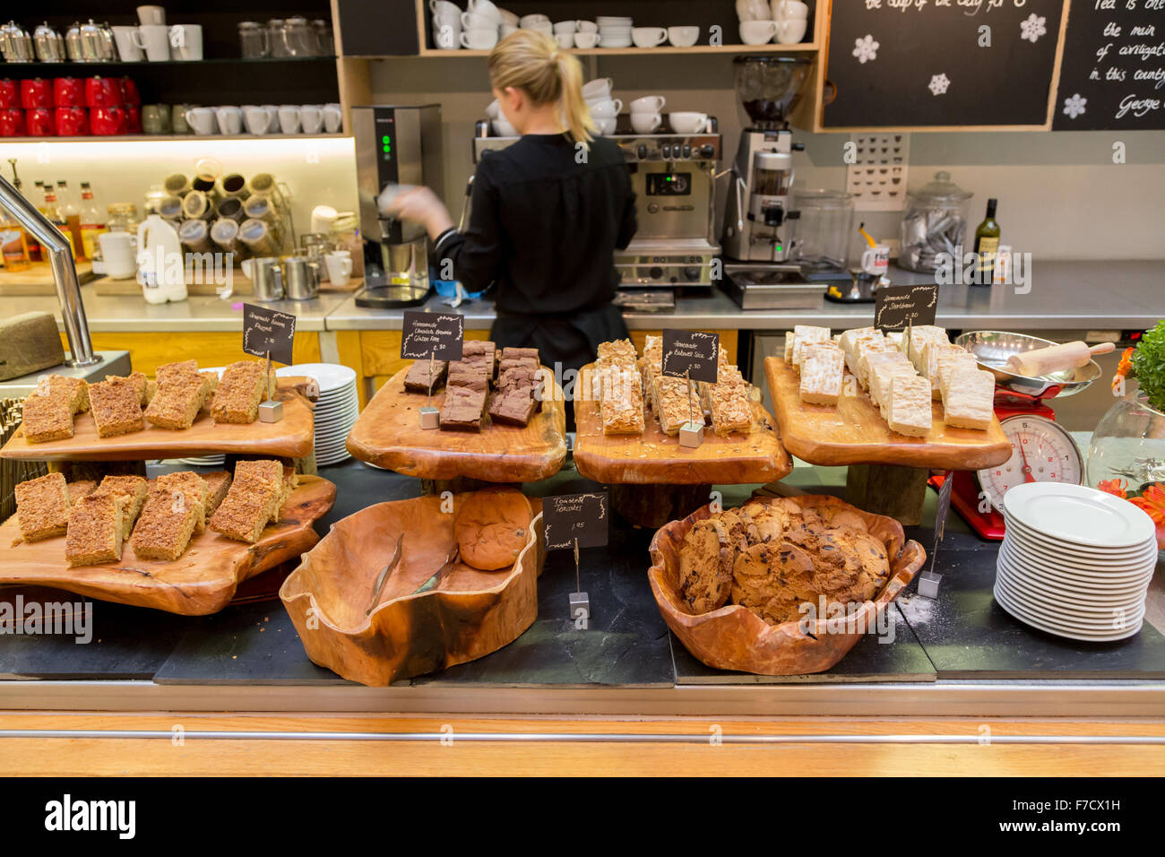 woman serving coffee and cakes in cafe at Bristol Museum and art