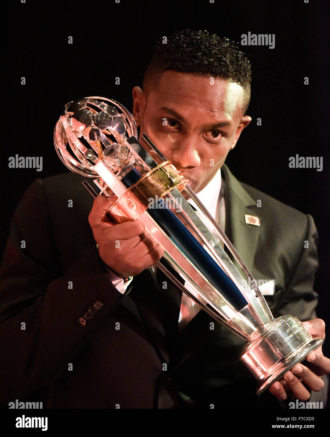 (151129) -- GURGAON, Nov. 29, 2015 -- (Xinhua) -- AFC Player of the Year Ahmed Khalil of the United Arab Emirates kisses his trophy during the 2015 AFC Annual Awards ceremony in Gurgaon, India, Nov. 29, 2015. (Xinhua/Bi Xiaoyang) Stock Photo