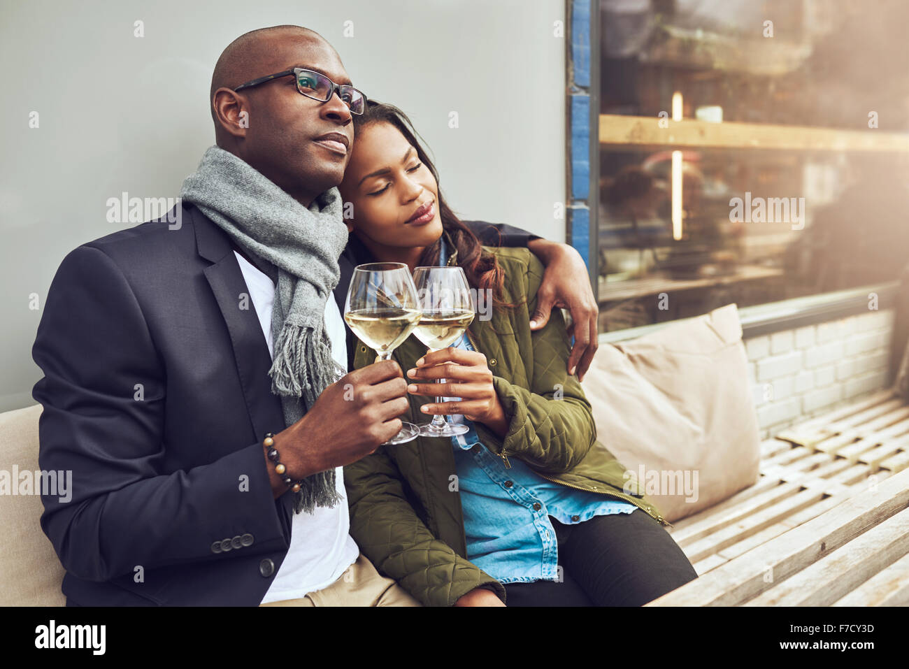 Romantic loving couple enjoying each others company sitting relaxing on