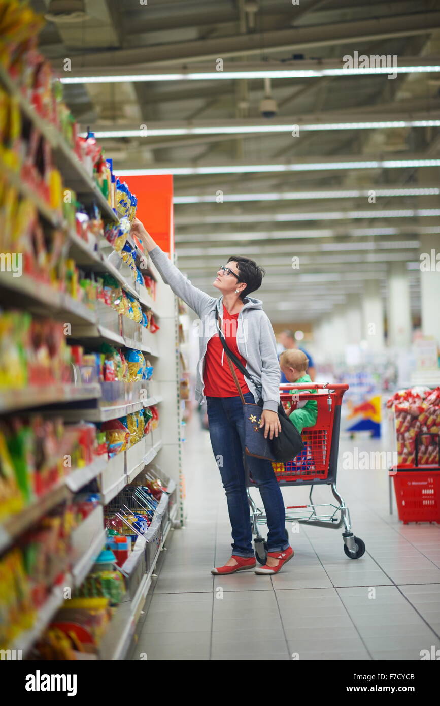 Budva, Montenegro - 17 march 2021: A child with a small trolley in the  supermarket, go shopping with his mother. The family goes shopping Stock  Photo - Alamy