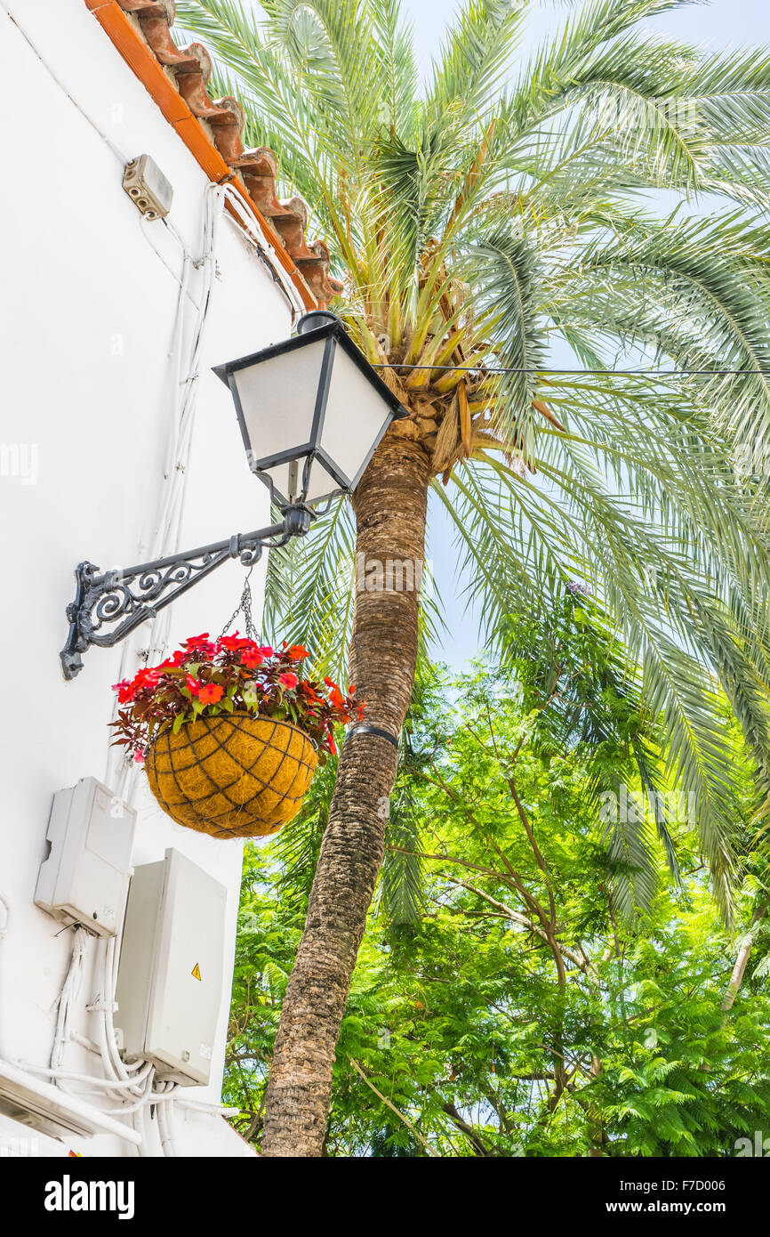 Tourism, narrow streets and typical of Marbella, white walls with floral balconies in Andalusia Spain Stock Photo