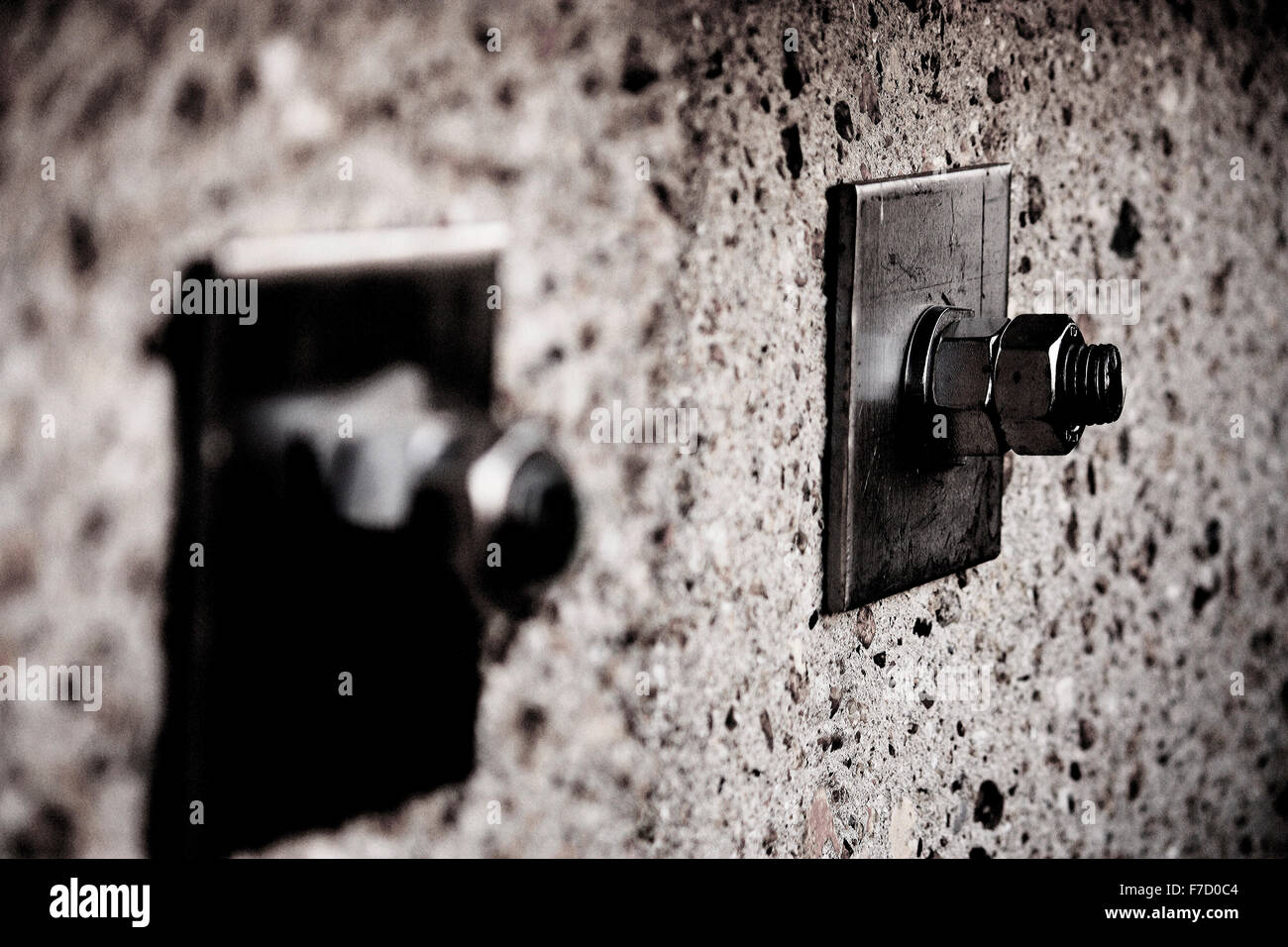 Pair of bolts in a wall Stock Photo