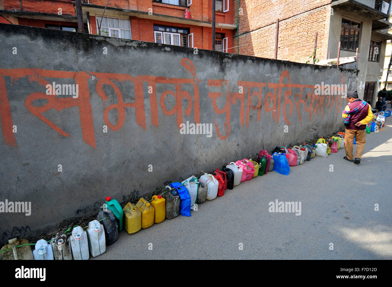 Kathmandu, Nepal. 29th Nov, 2015. Nepalese people count the Plastic gallons and bottles puts on a queue of Kerosene to get 2ltrs of Kerosene at Kirtipur, Kathmandu, Nepal on 29 November, 2015. As from the past few months neighboring India had Blockade the Border; which transport fuel and daily commodities to Nepal; results shortage of fuel and daily commodities in Nepal. © Narayan Maharjan/Pacific Press/Alamy Live News Stock Photo