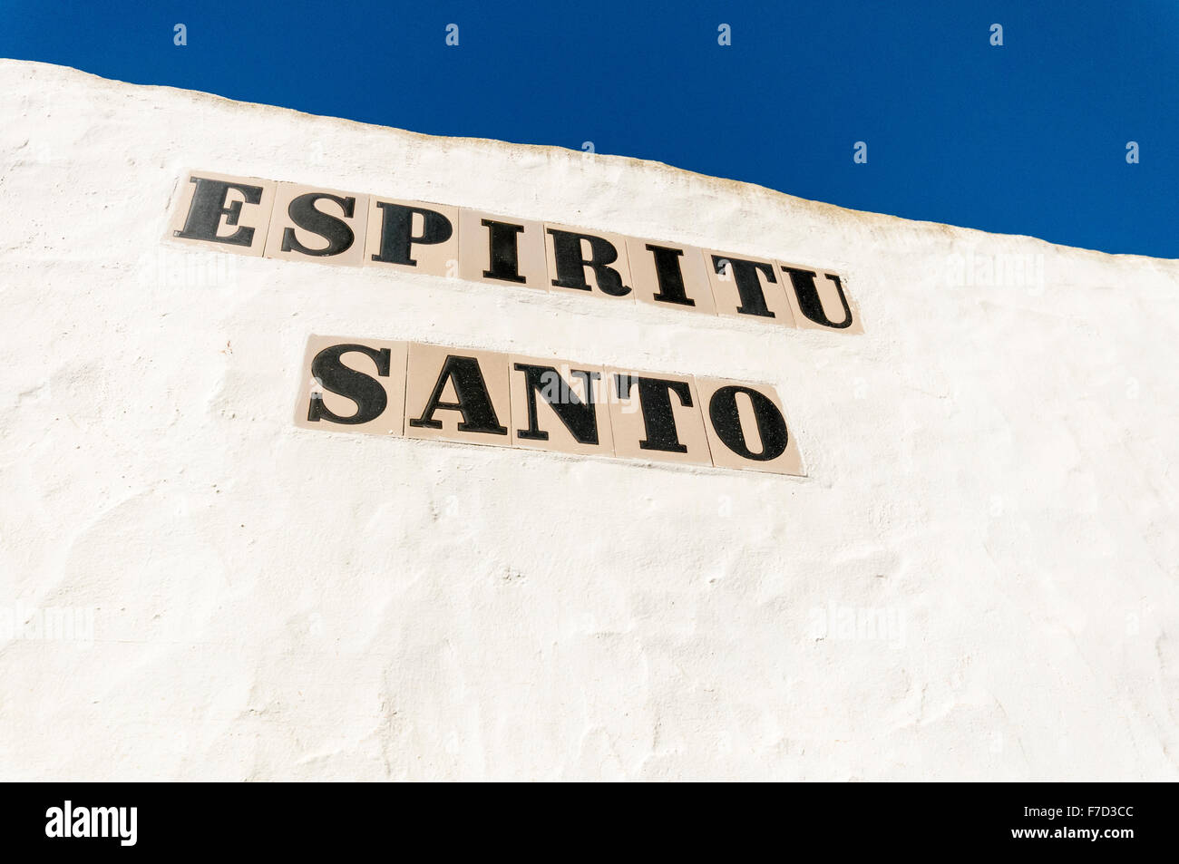 'Espiritu Santo' sign on a white wall in a Spanish town Stock Photo