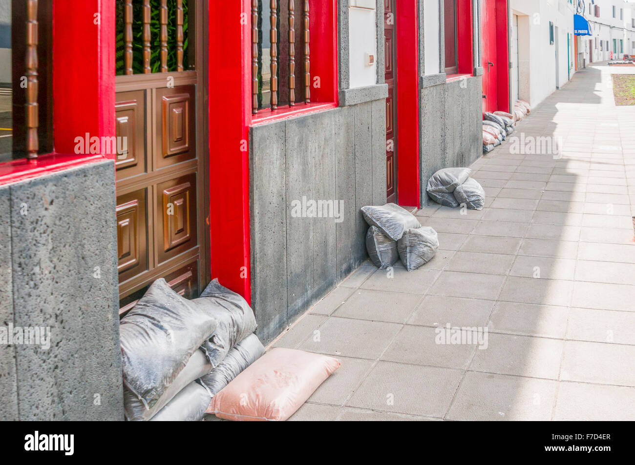 Sandbags protect doors at Arietta, Lanzarote after highly unusual and severe storms and flooding Stock Photo