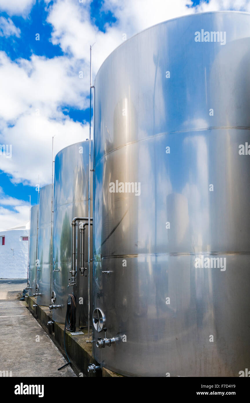 Stainless steel fermenting vats at a vineyard. Stock Photo