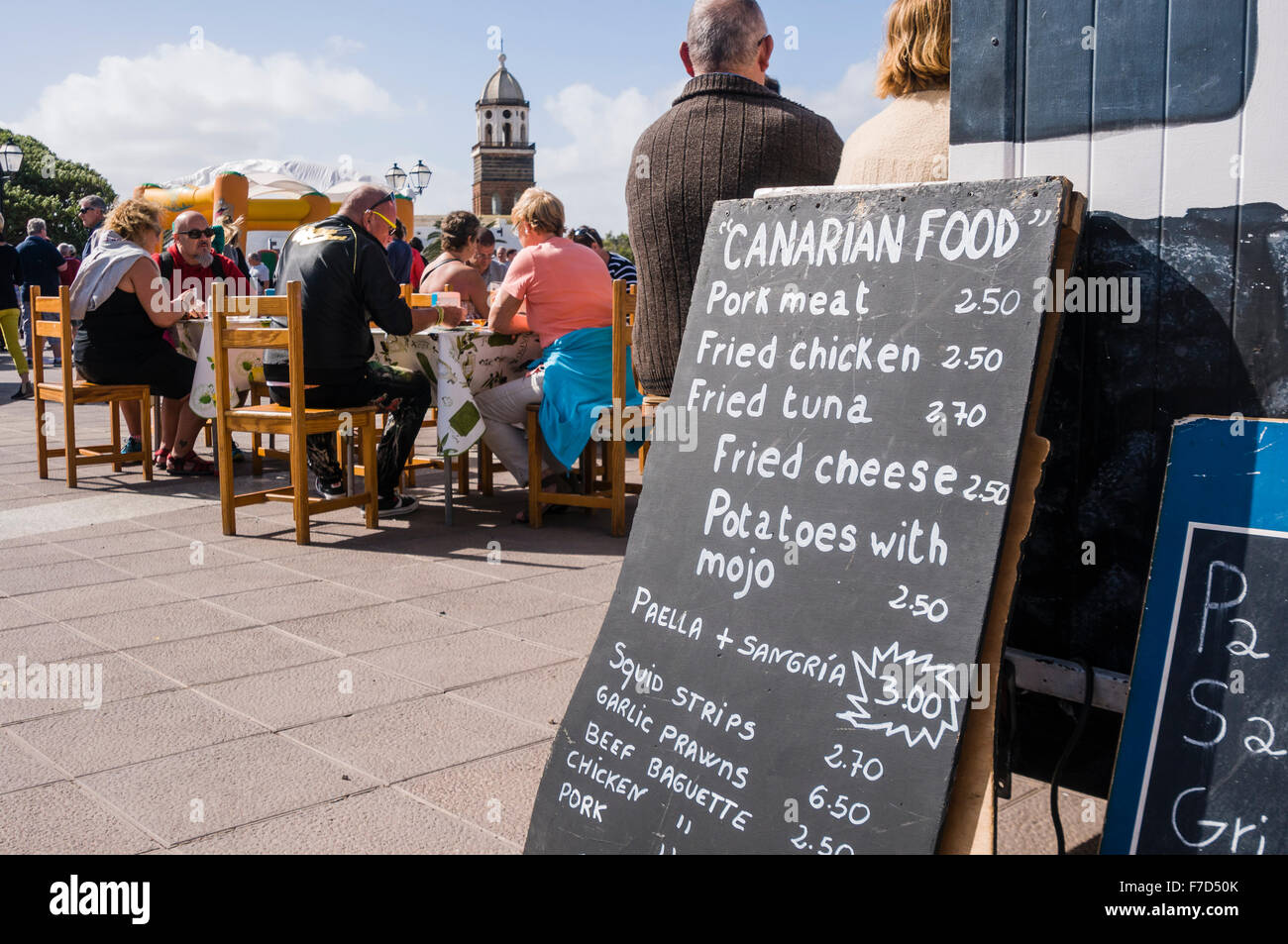 Sign at a food stall at the Sunday Market in the Lanzarote town of Teguise advertising local Canarian food Stock Photo