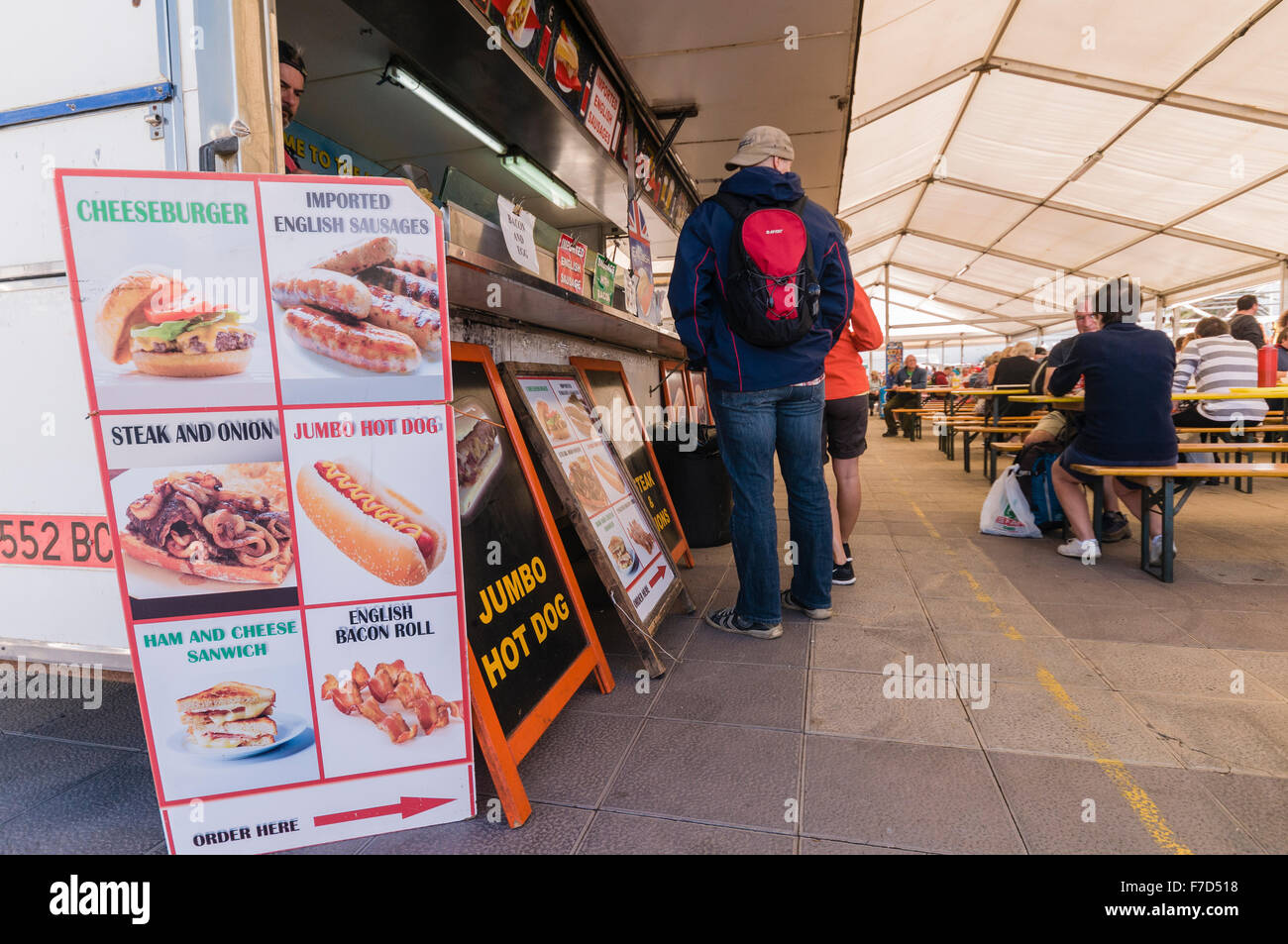 Sign in a Spanish tourist resort market stall advertising real British English food at a cafe van Stock Photo