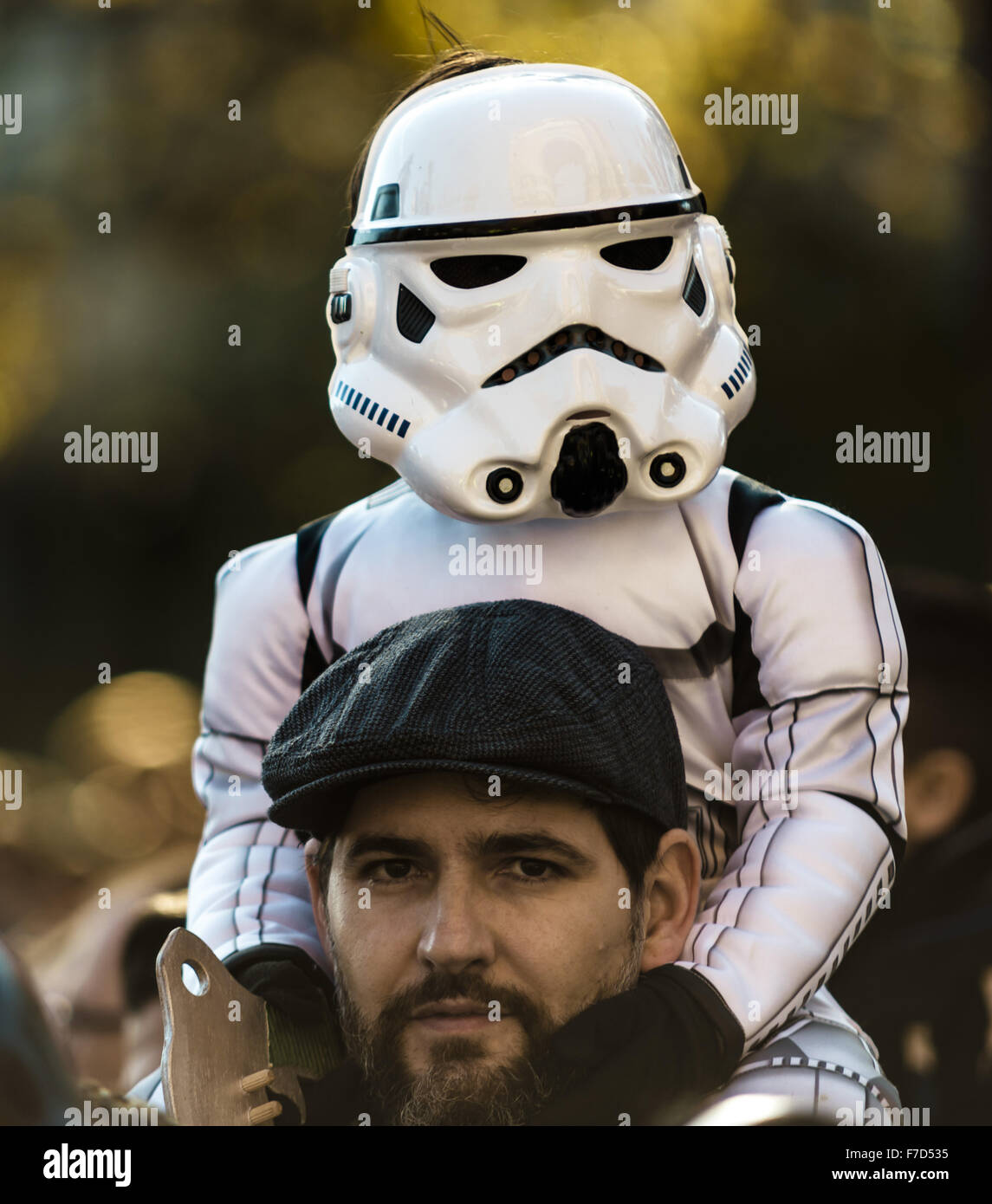 Barcelona, Catalonia, Spain. 29th Nov, 2015. A boy taking part in the 9th Star Wars parade in front of Barcelona's Arc de Triomf on the shoulders of his father is dressed up as the 'Stromtrooper' movie characters © Matthias Oesterle/ZUMA Wire/Alamy Live News Stock Photo