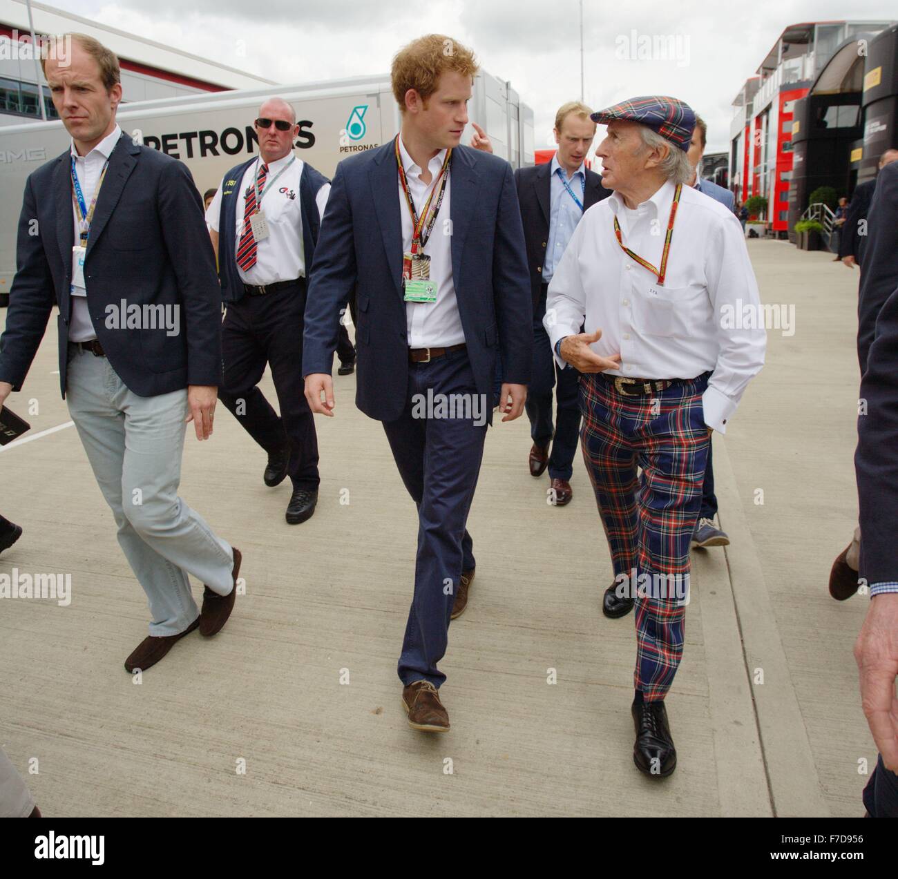 Prince Harry is given a guided tour of the paddock by Sir Jackie Stewart before the start of the Silverstone Grand prix Stock Photo