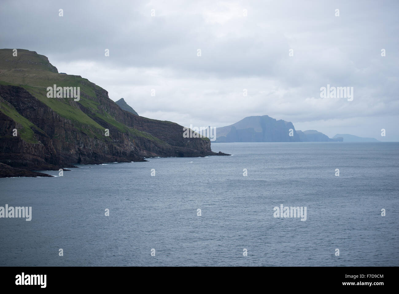 Typical landscape on the Faroe Islands, with green grass and rocks Stock Photo