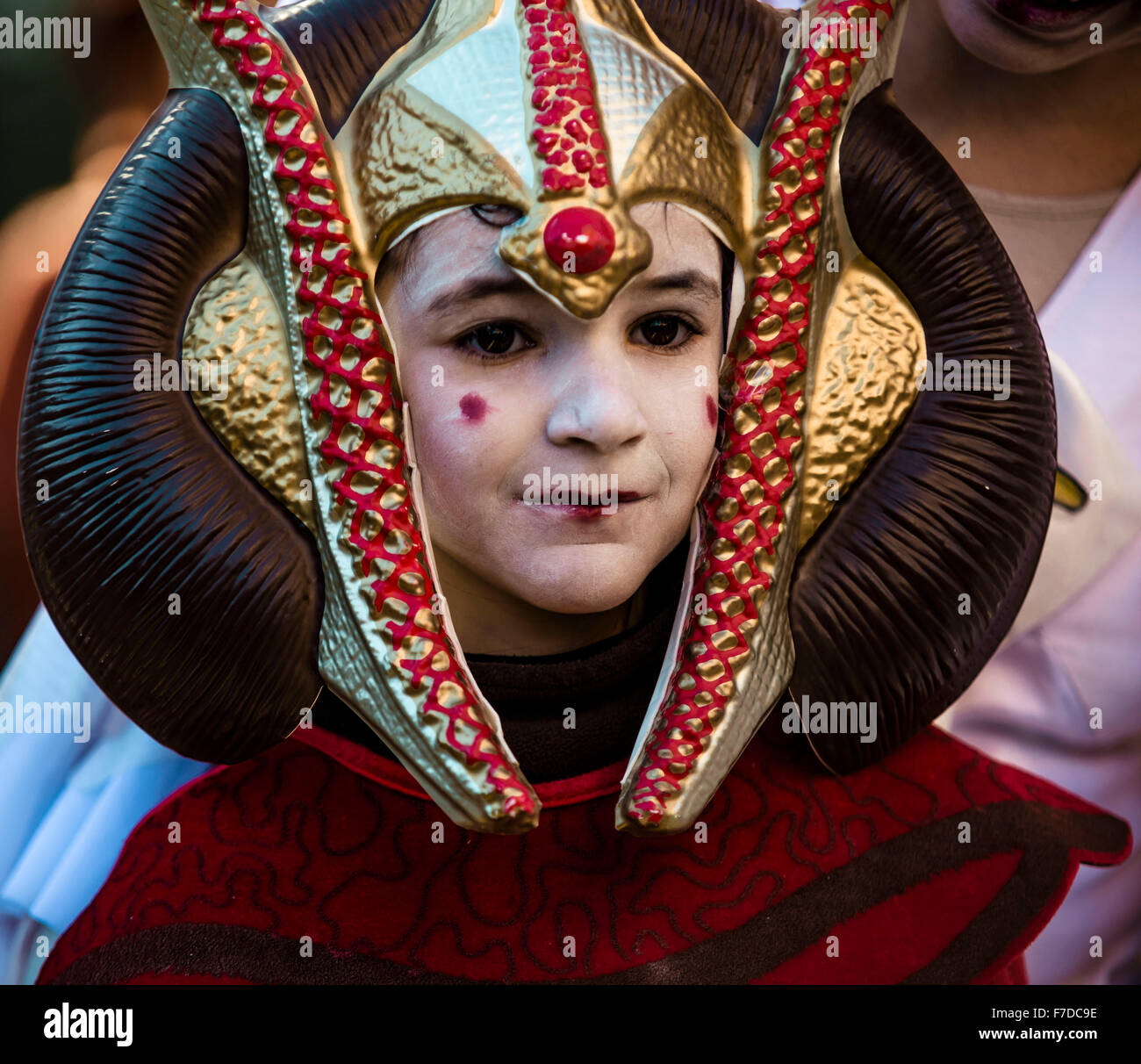 Barcelona, Spain. 29th November, 2015. A girl taking part in the 9th Star Wars parade in front of Barcelona's Arc de Triomf is dressed up as the 'Sabé' movie character Credit:  matthi/Alamy Live News Stock Photo
