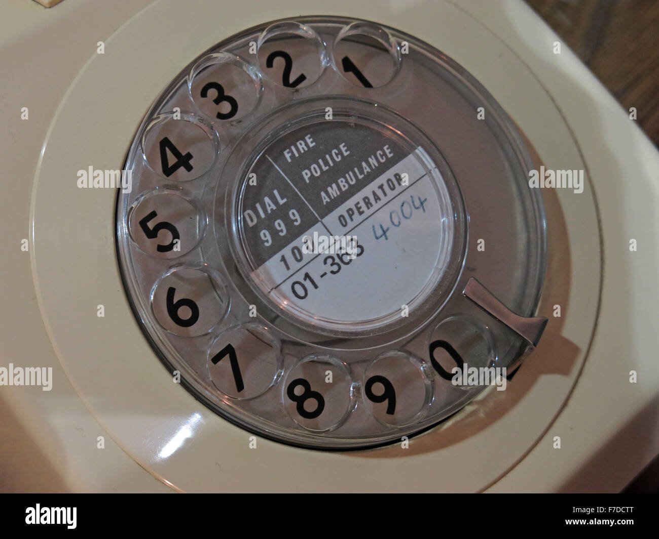 Cream GPO telephone type 746 with 01 London number on rotary dial, UK Stock Photo