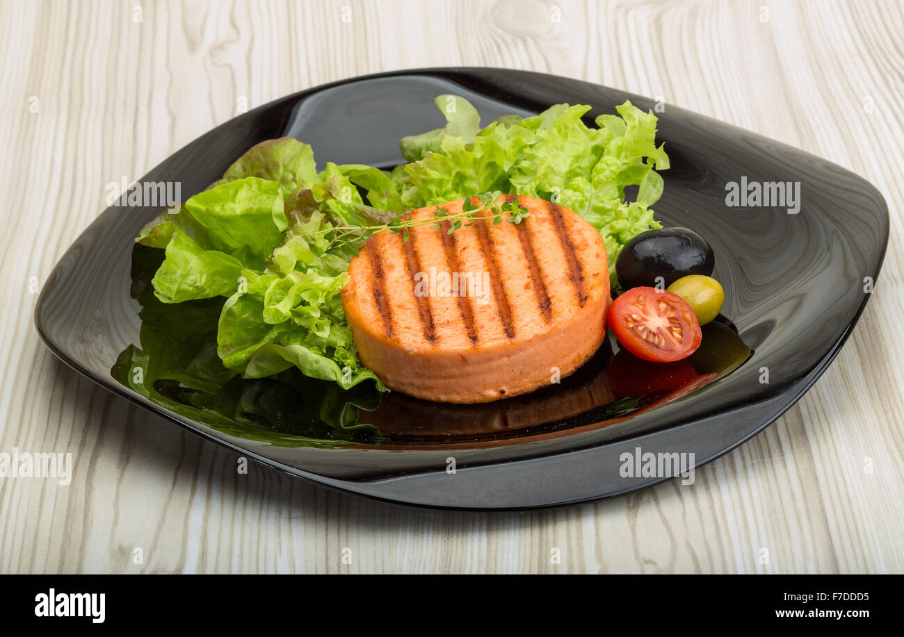 Grilled Fish cakes in the bowl with salad leaves Stock Photo - Alamy