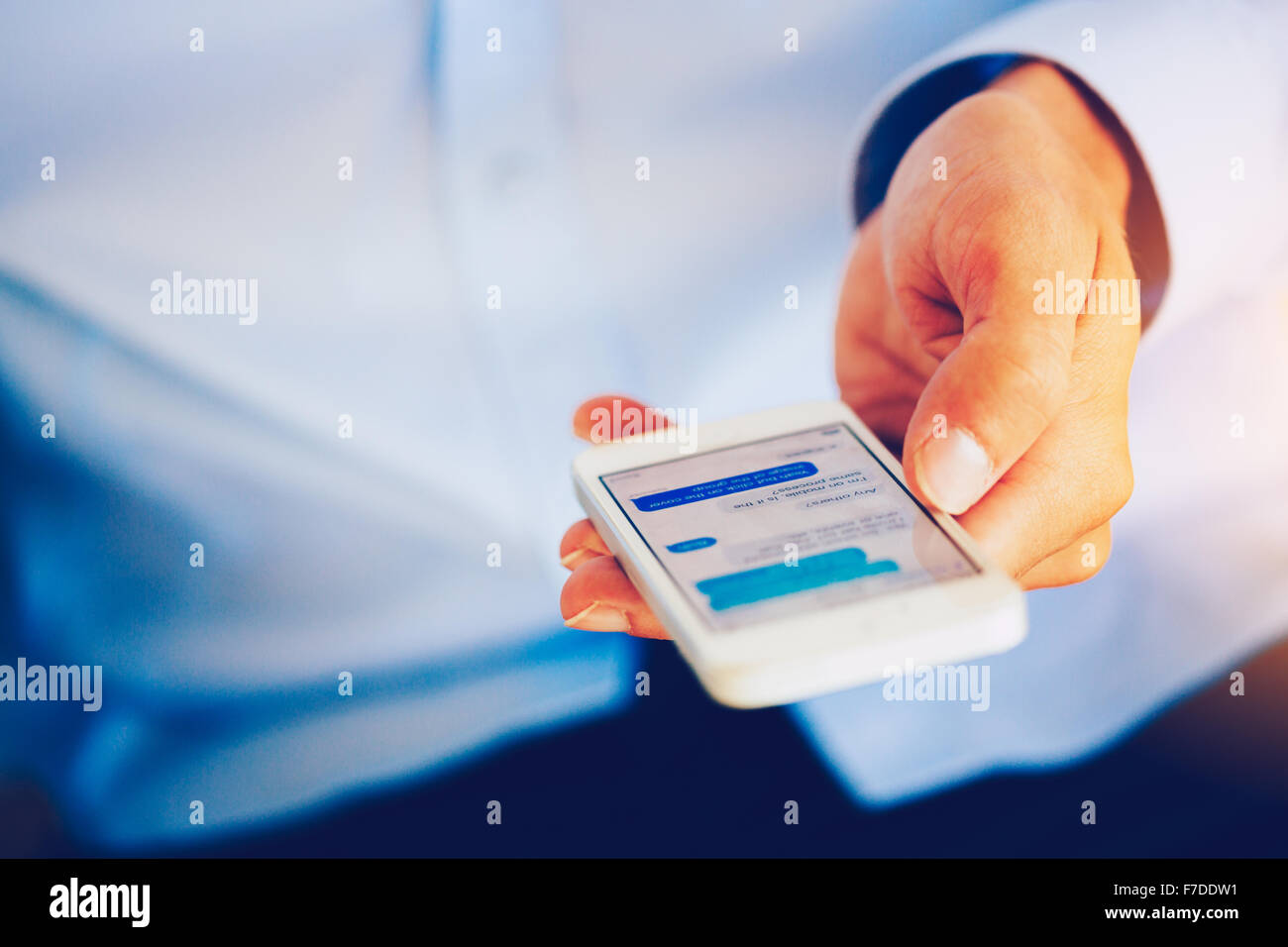 Close up of Young Man Using Mobile Smart Phone Stock Photo - Alamy