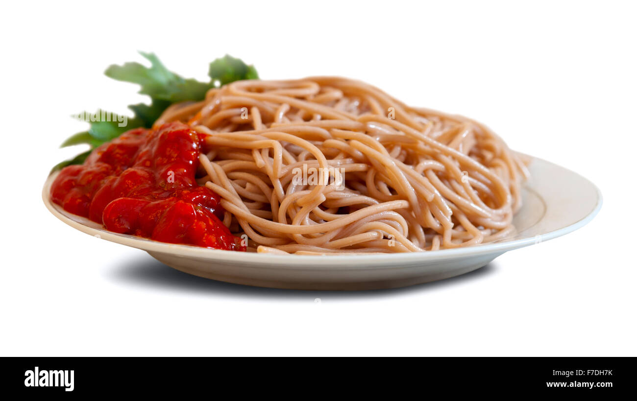 spaghetti pasta with tomato sauce in plate over white background with shade Stock Photo