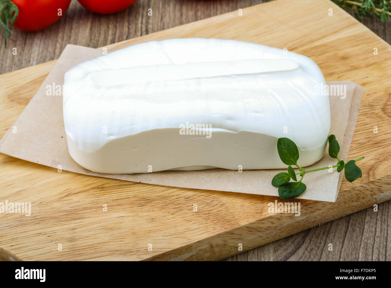 Traditional Greek cheese - Feta with herbs on the wood background Stock ...