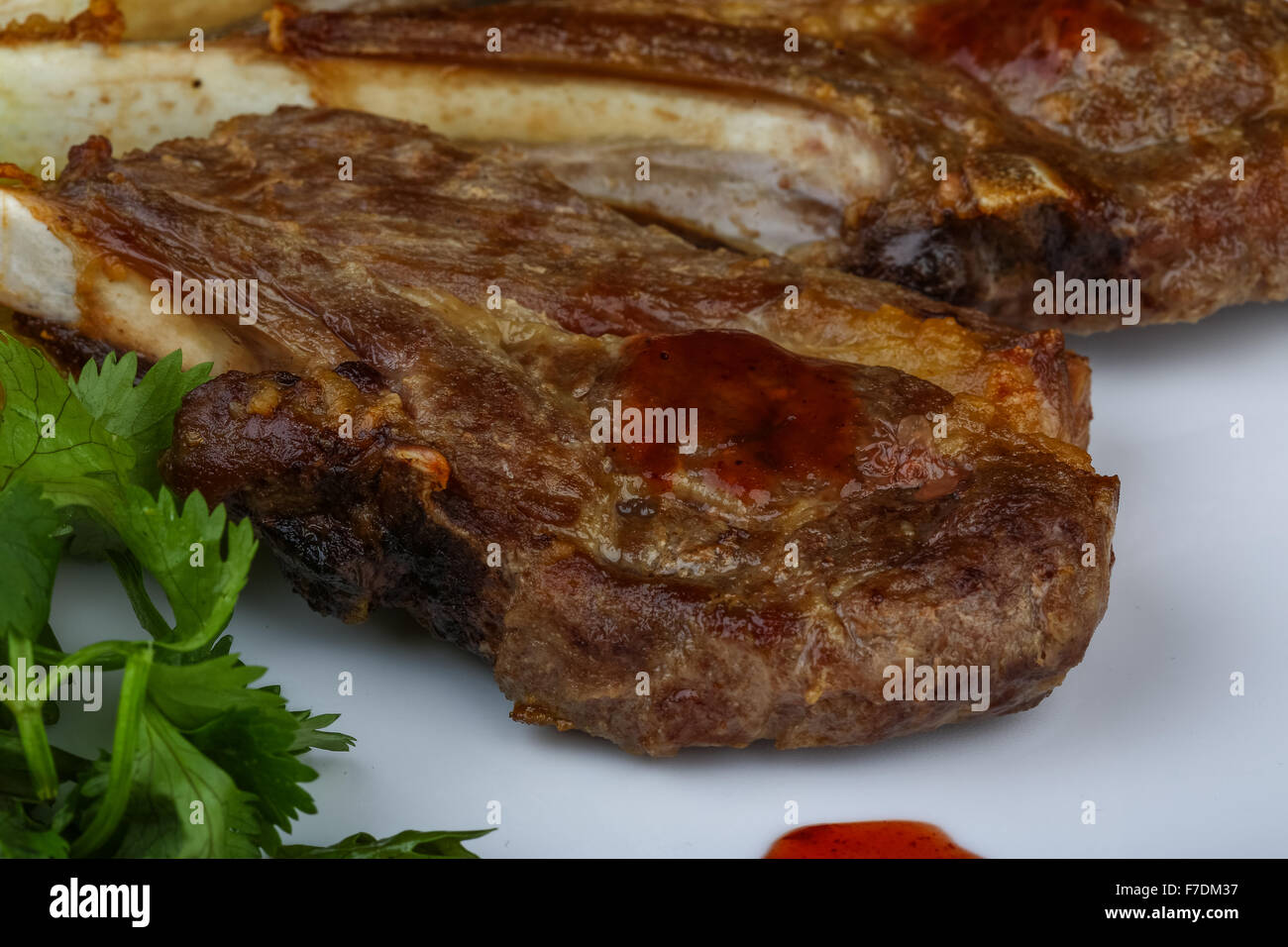 Grilled Lamb chops with eggplant and coriander leaves Stock Photo - Alamy