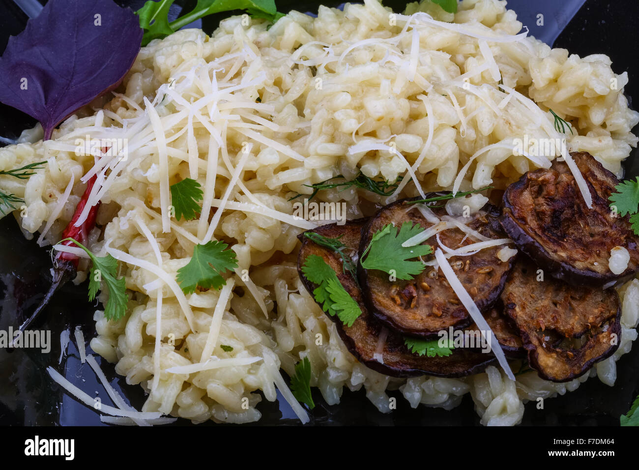 Italian trditional Risotto with eggplant and coriander Stock Photo Alamy
