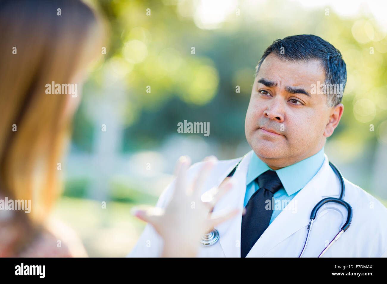 Mexican doctor talking patient hi-res stock photography and images - Alamy