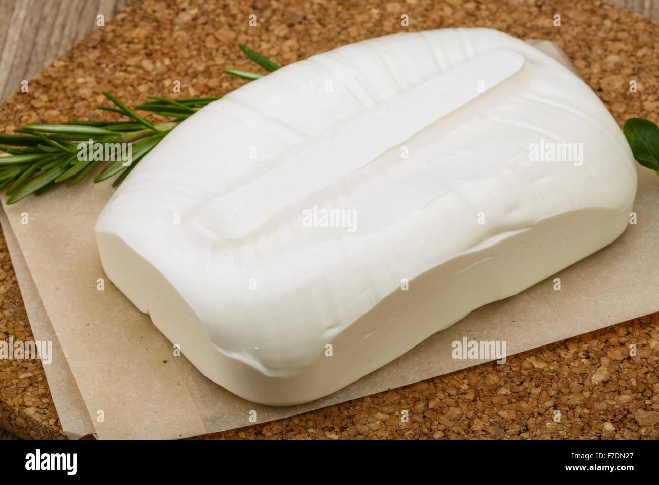 Traditional Greek cheese - Feta with herbs on the wood background Stock ...