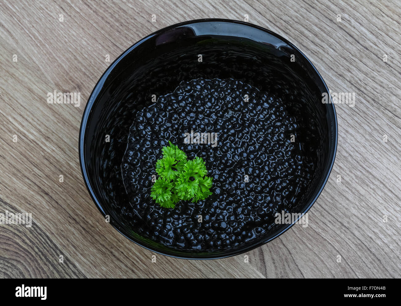 Luxury Black caviar in the bowl with parsley leaves Stock Photo Alamy