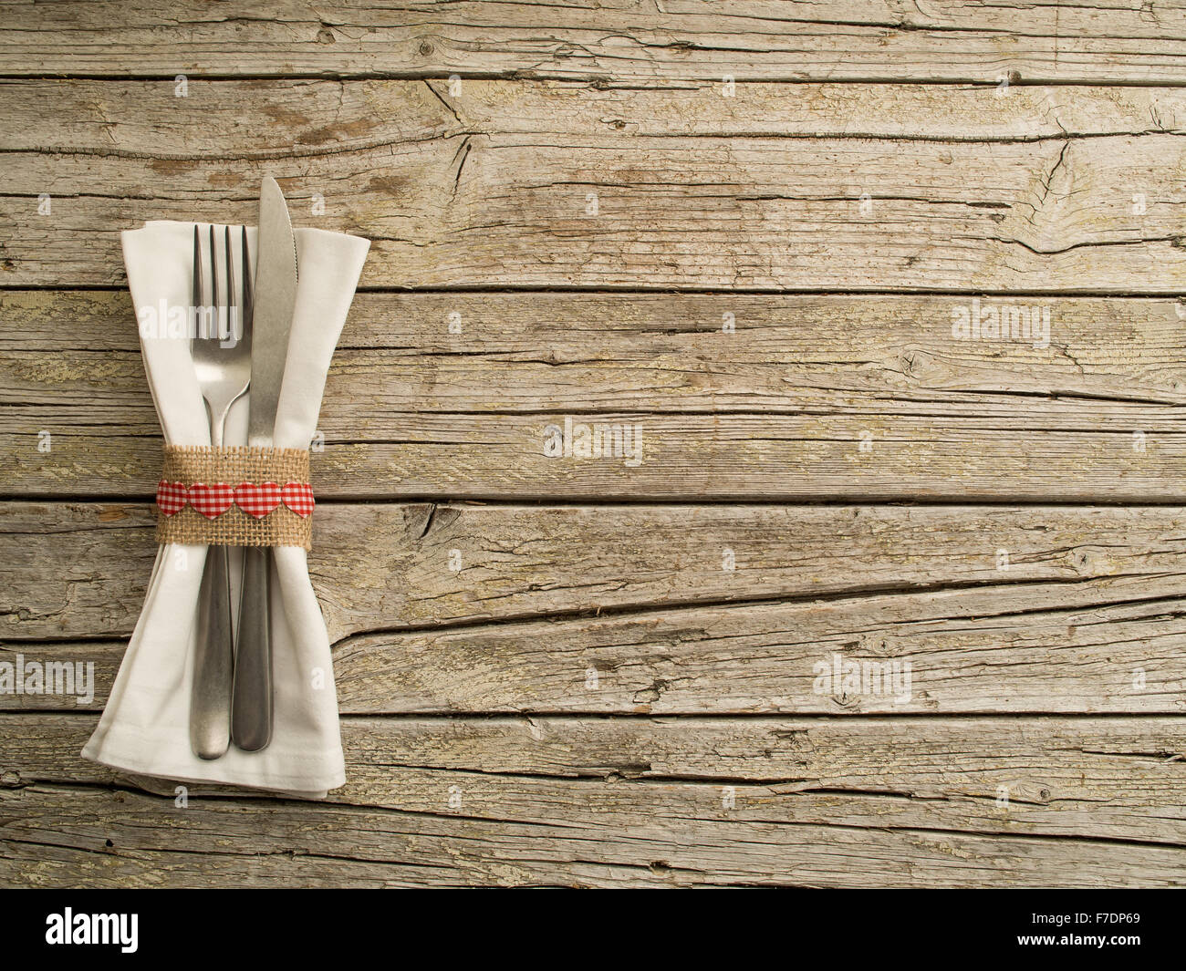 Cutlery kitchenware on old wooden boards background food concept Stock